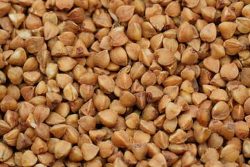 Buckwheat Groats Dry Uncooked Raw Natural Fresh Brown. Roasted buckwheat kernels. Healthy organic food. Background. 