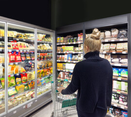 supermarket shopping,Woman choosing a dairy products at supermarket.
