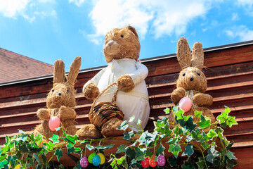 Easter decoration with Easter bunnies and Easter eggs on a house