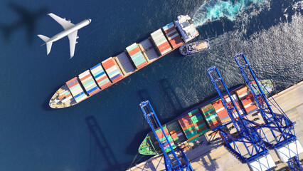 Aerial drone top down concept photo of container terminal and plane flying above indicating popular...