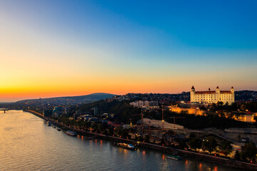 Fototapeta premium View of Bratislava castle, old town and the Danube river from observation deck the bridge in Bratislava, Slovakia at night