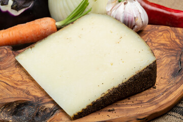 Cheese collection, aged hard Italian sheep cheese black pecorino from Sicily island or pecorino nero di Sicilia