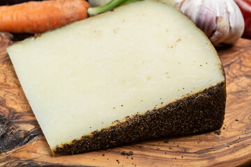 Cheese collection, aged hard Italian sheep cheese black pecorino from Sicily island or pecorino nero di Sicilia