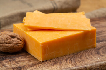 Leicestershire cheese or red leicester, British hard cheese made from cow milk close up