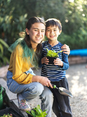 Smiling girl and boy in the garden