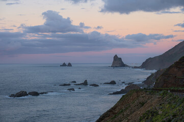 Beautiful sunset at seaside. Beautiful nature background. Mountains and waves.