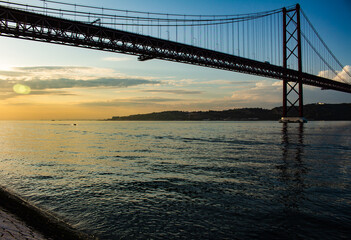 Suspension bridge in the city of Lisbon. Huge metal structure