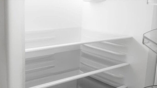 Opening and closing the door of fridge. Animation of an empty refrigerator.