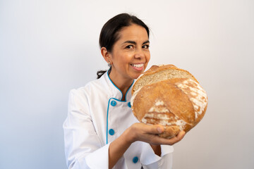 Chef showing open freshly baked round bread