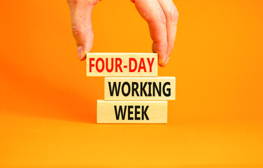 Four-day working week symbol. Concept words Four-day working week on wooden block on a beautiful orange table orange background. Businessman hand. Business four-day working week concept. Copy space.