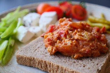 morning breakfast with tomato mixed Scrambled eggs on a bread 