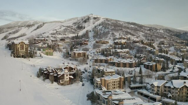 Overview of ski gondola on ski resort mountain town in Steamboat Springs, Colorado - 4K Drone