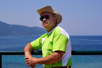 Portrait of an adult man near the beach - 581229867