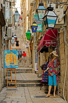 Maniken and lamps along  narrow Street in Dubrovnik, Croatia