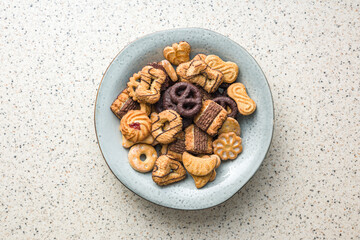 Assorted various cookies. Sweet biscuits on plate. Top view.