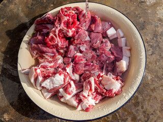 The meat is washed in the tap.