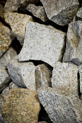 Loose granite stones lying on the street.