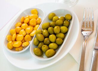 Delicious spanish tapas from olives and pickled beans at plate