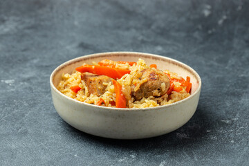 pilaf in a bowl, Uzbek dish. rice meat with vegetables. Restaurant menu, dieting, cookbook recipe top view
