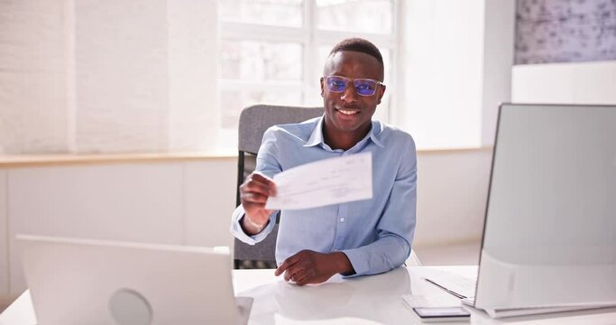 Holding Paycheck Or Payroll Check Or Insurance Cheque