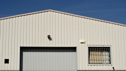 industrial warehouse building facade against the sky