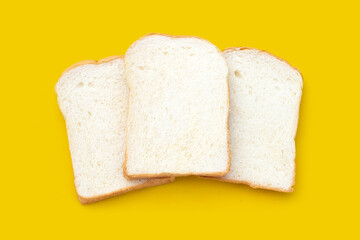 Sliced bread on yellow background.