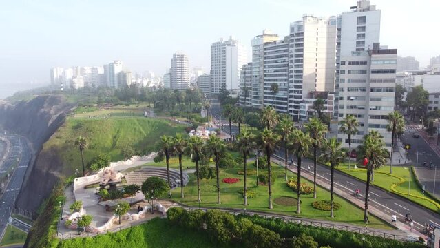 An urban drone aerial shot of Miraflores, Lima, Peru in early morning summer. Showing the city 