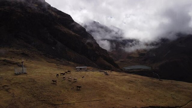 An aerial drone shot revealing the Andes mountains of Huaytapallana in Junin, Peru. Altitude 5000 meters