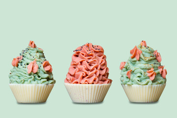 Colorful cupcake bakery soaps on green background