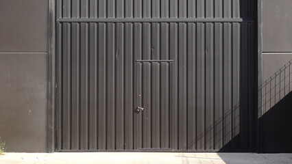 metal door of industrial building warehouse as background