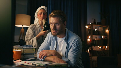 Funny woman distracted husband closeup. Freelancer talking with client remotely