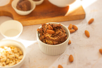 Vegan sweet hummus spread with almonds on the table in the kitchen, Vegan concept