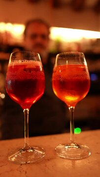 Indulge in the refreshing taste of Italy's signature Enjoy Italy's iconic Aperol Spritz, the perfect refreshing beverage to sip on a warm day in Venice