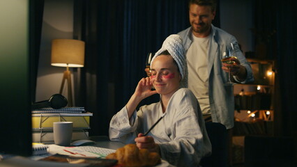 Family enjoying together home closeup. Man bringing woman wine glass at evening