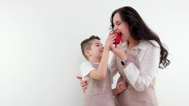 Woman and little boy having a healthy salad for snack. High quality photo