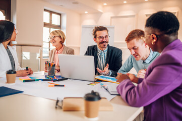 Multiracial business group of people having a meeting in an office