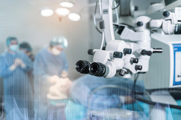 Surgical microscope in operating room with doctors. Ophthalmological clinic. Microsurgical optical...