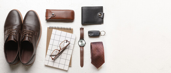 Set of stylish male accessories with notebooks on light background with space for text