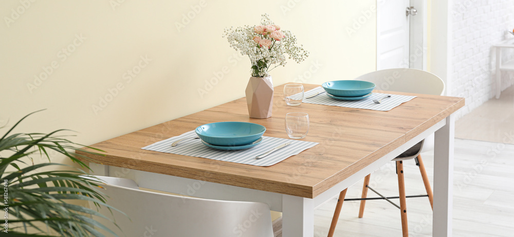 Sticker beautifully served table in light dining room