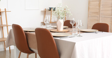 Beautifully served table in light dining room