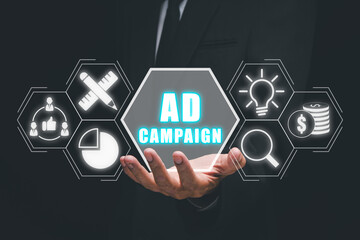 Ad Campaign concept, Business person hand holding ad campaign icon on virtual screen.