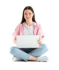 Naklejka premium Sitting young woman with laptop isolated on white
