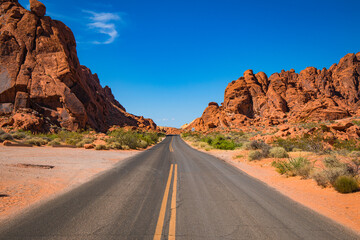 Deserted Desert Road with Sandstone Rock formations
