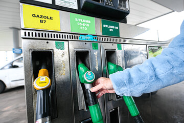 Illustration picture shows a person using a petrol pump (unleaded fuel, 