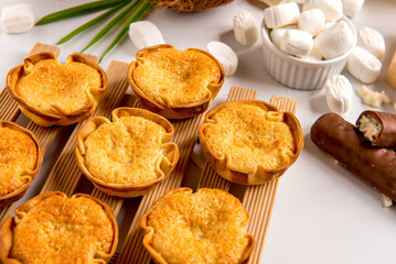 Coconut delights on a white background, coconut candy and sweets