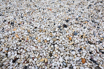 Trendy small sea stone pebble background. Softcolored abstract beach nature pattern