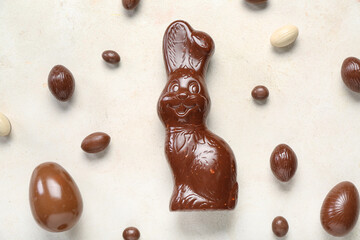 Chocolate Easter bunny with eggs on white background