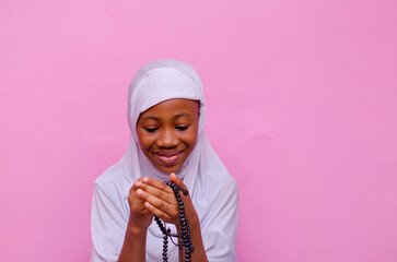 young beautiful excited Muslim girl praying