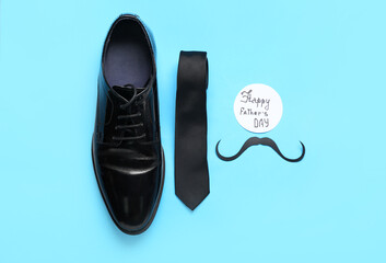 Composition with stylish male shoe, tie and card with text HAPPY FATHER'S DAY on color background