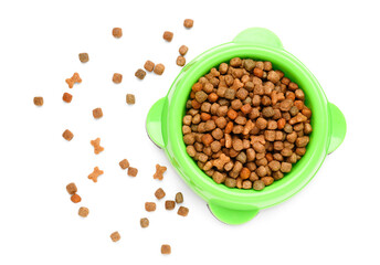 Bowl of dry pet food isolated on white background